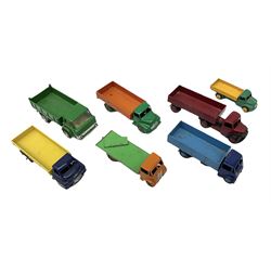Dinky - seven unboxed and playworn/repainted die-cast commercial vehicles comprising Bedford Articulated lorry, Leyland Comet, Big Bedford, Ford 800 tipper truck, Guy flatbed and planked flatbed lorries and Dodge tipper truck (7)