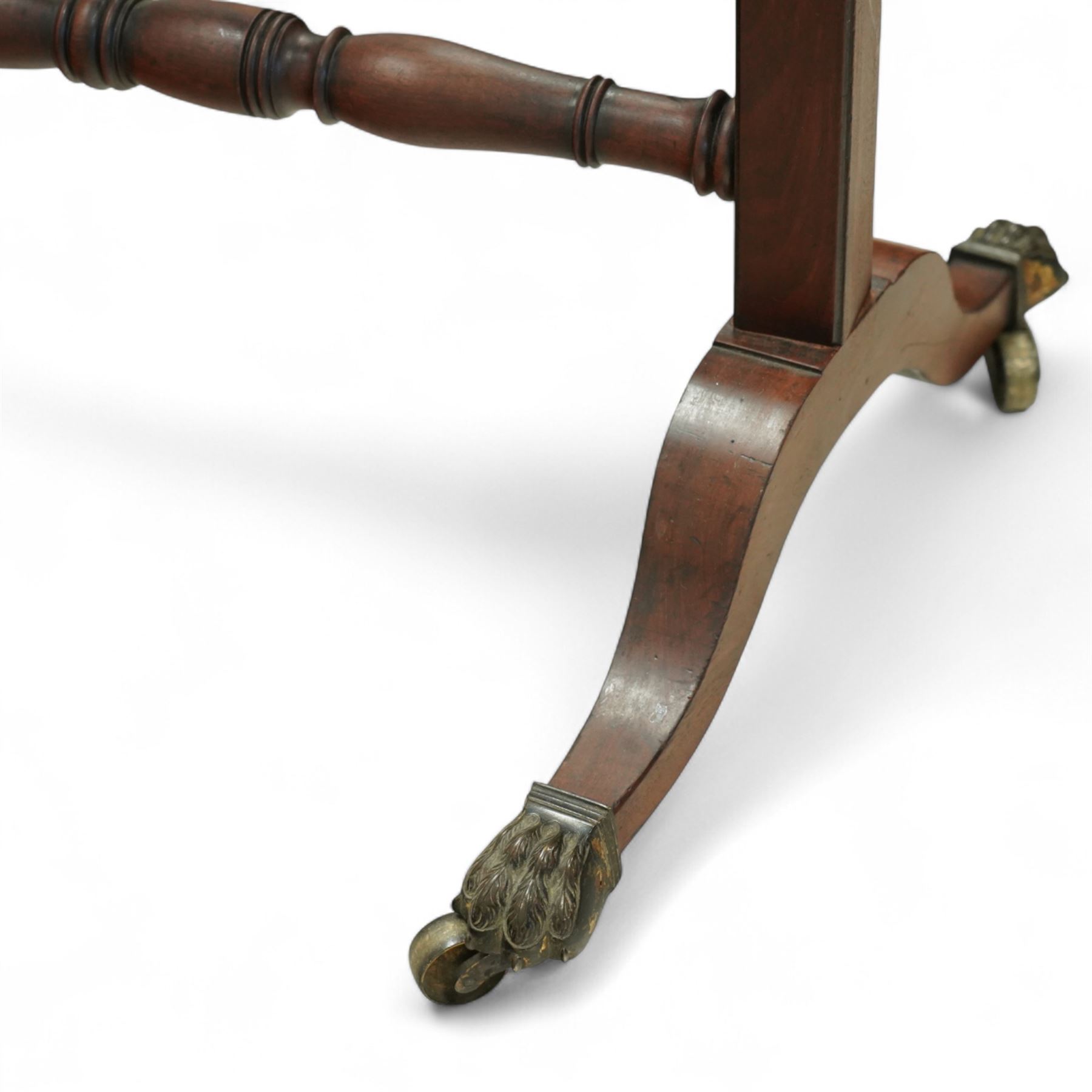 Late 19th-century Regency-style mahogany cheval mirror, rectangular mirror plate within turned uprights and turned cross stretchers supported on down-swept legs terminating in brass paw castors 