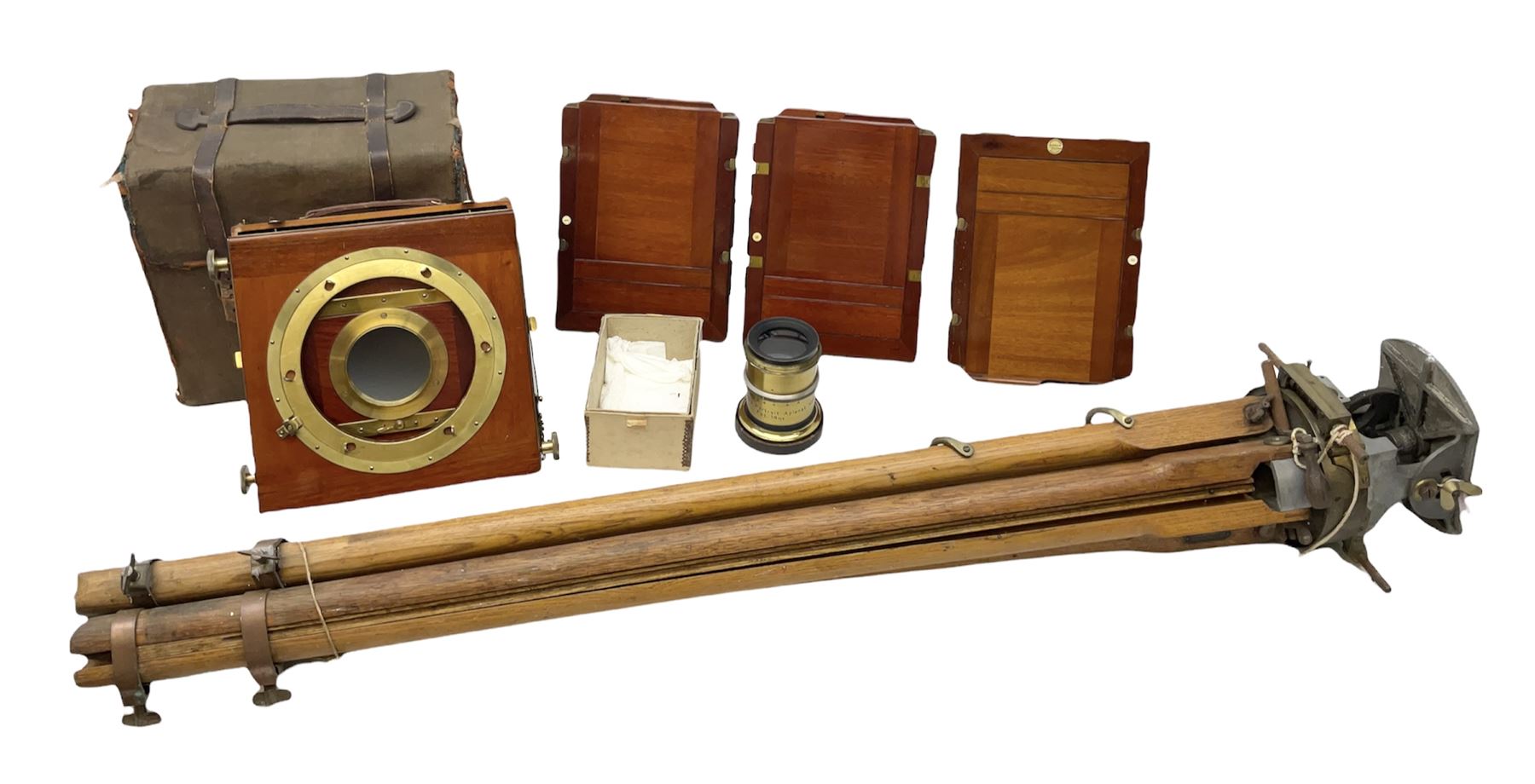 Thornton Pickard folding plate camera in mahogany and lacquered brass, no.529946 and no.529947, field model with canvas wrapped box, three mahogany photographic plates, 'Busch's Portrait Aplanat No4 Foc.14inc' lens and a wooden tripod
