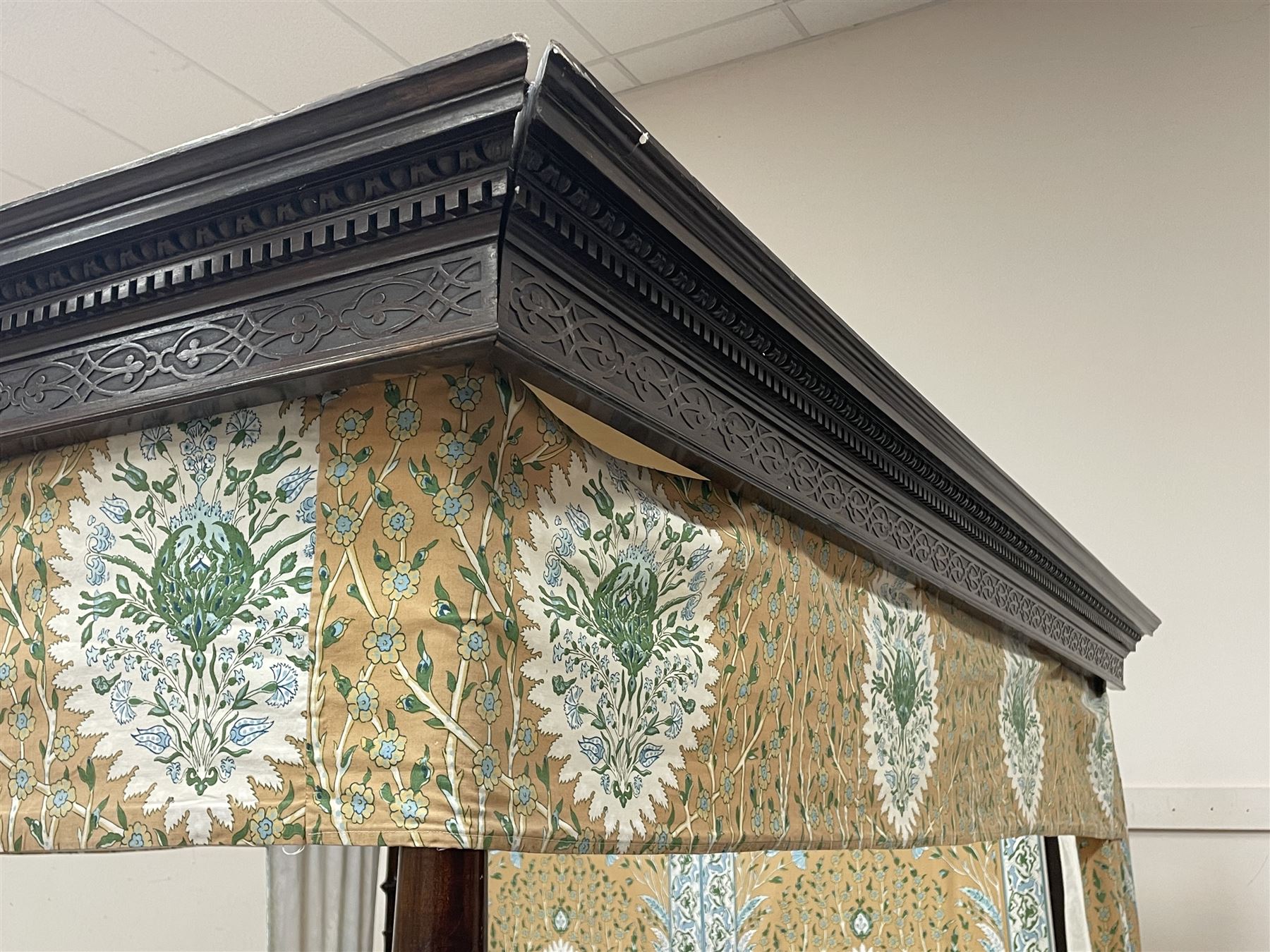 Early 20th century Chippendale style mahogany four poster bed, projecting dentil cornice with egg and dart mouldings and blind fretwork frieze, tapering reeded supports, with bed base