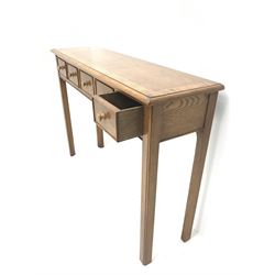 Contemporary oak, mahogany, and figured burr walnut narrow console table, moulded rectangular top with oak band and satinwood stringing, five cock beeded short drawers with turned handles, moulded and canted square supports 