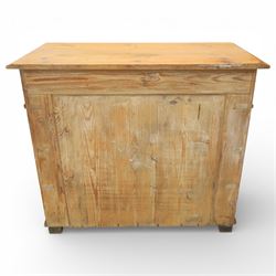 Late Victorian pine chest of drawers, the moulded top above four long drawers with brass drop handles and flower head escutcheons, flanked by pilasters, upon four turned compressed bun feet, 89cm x 103cm x 54cm