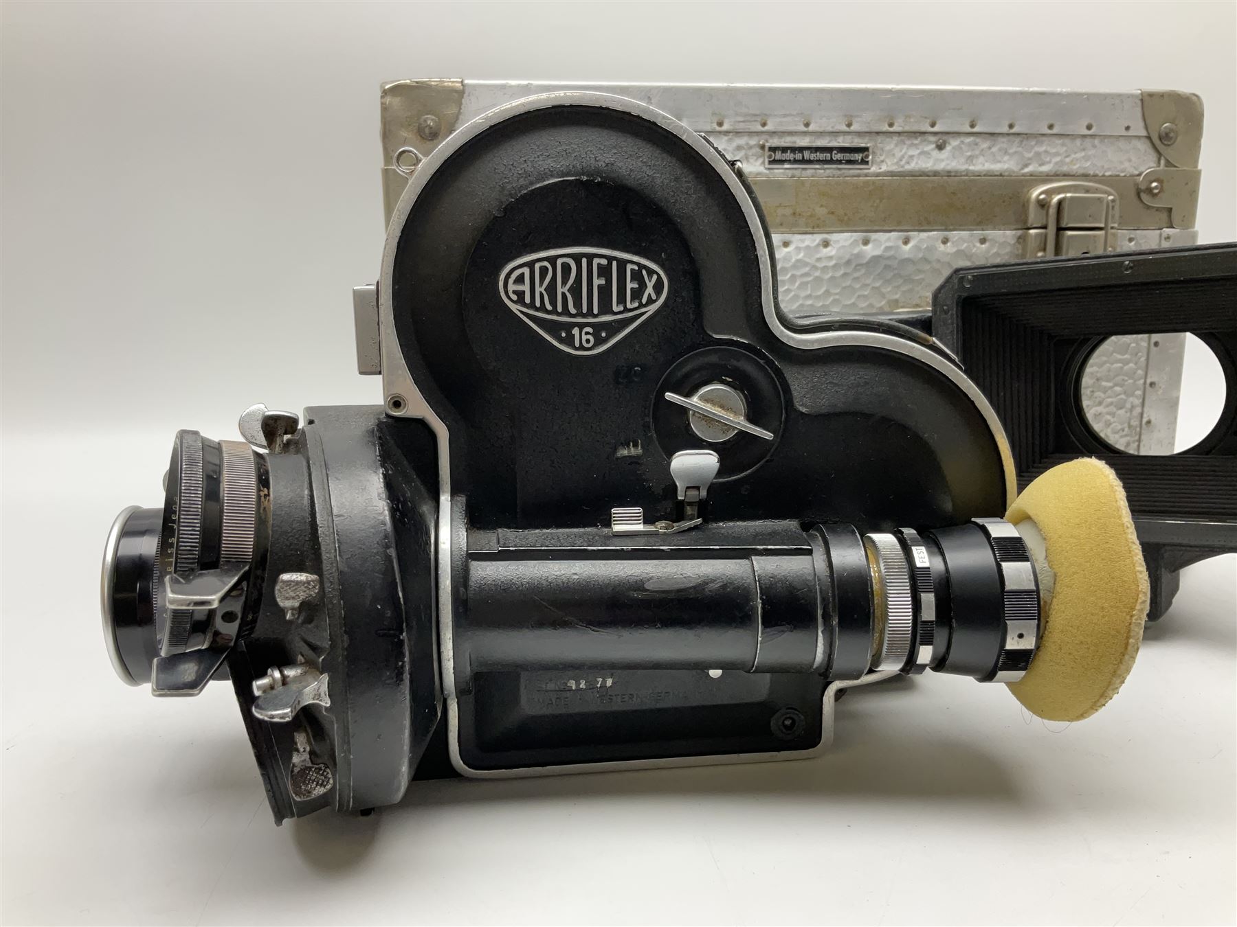 Arriflex 16SB camera body, serial no. 1784, with ' Carl Zeiss Distagon 1:2 f=8mm' lens, serial number 3860224, 'Carl Zeiss Jean Tessar 2/16' lens, serial no 3624355, camera pistol grip and other accessories, in fitted hard case