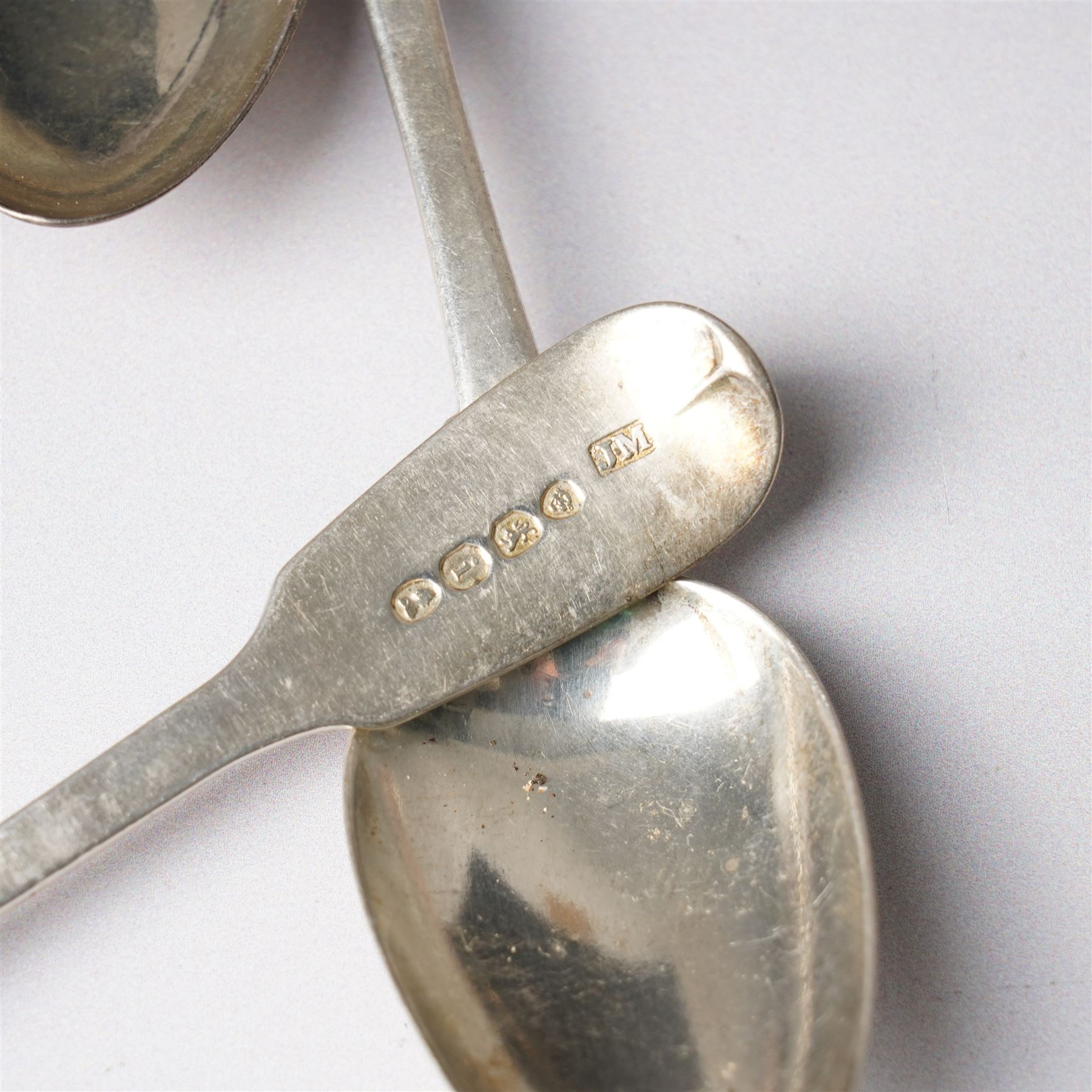 Three George IV silver fiddle pattern teaspoons London 1824, pair of George IV silver condiment spoons, four various silver teaspoons, three Charles Horner thimbles, three other silver thimbles, plated thimbles, two plated decanter labels and a plated Coronation spoon