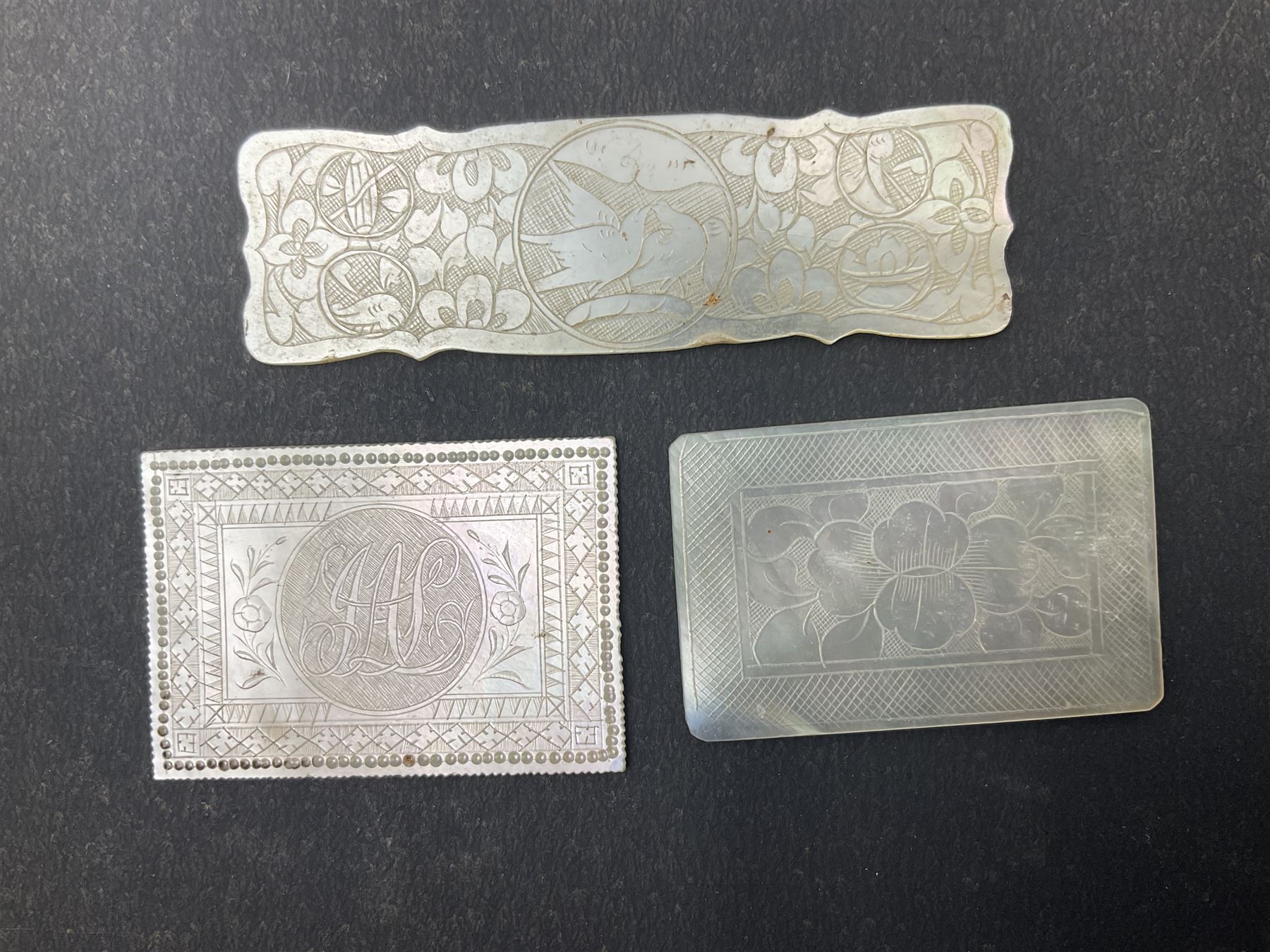 Two silver fruit knives with mother of pearl handles, hallmarked, mother of pearl tokens and similar items 