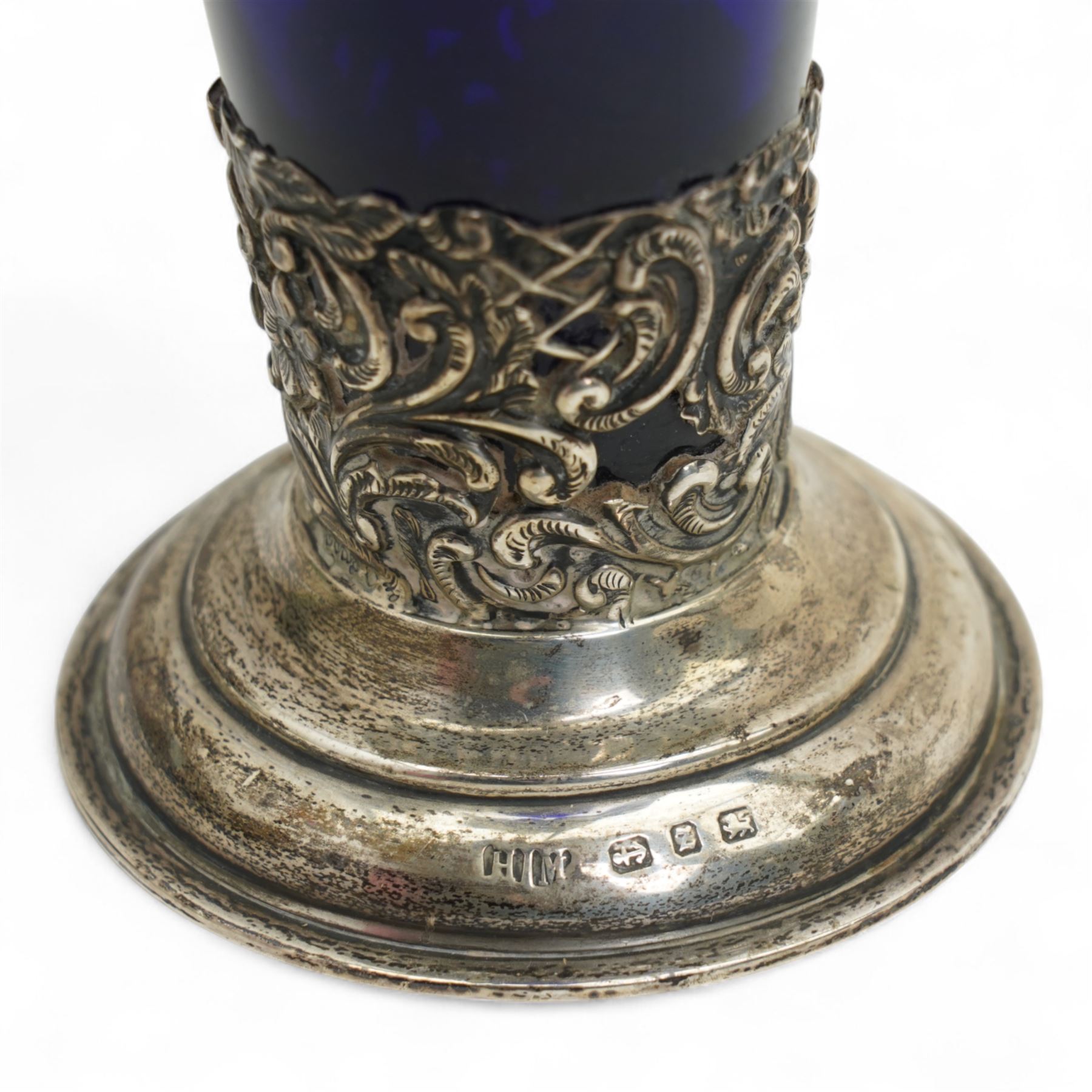Late Victorian blue glass trumpet shape vase in pierced silver frame H20cm Birmingham 1899, modern blue glass globe scent flask with silver cover, two cranberry glass beakers in silver frames, cranberry sugar bowl in silver frame and blue glass sugar bowl with silver collar 
