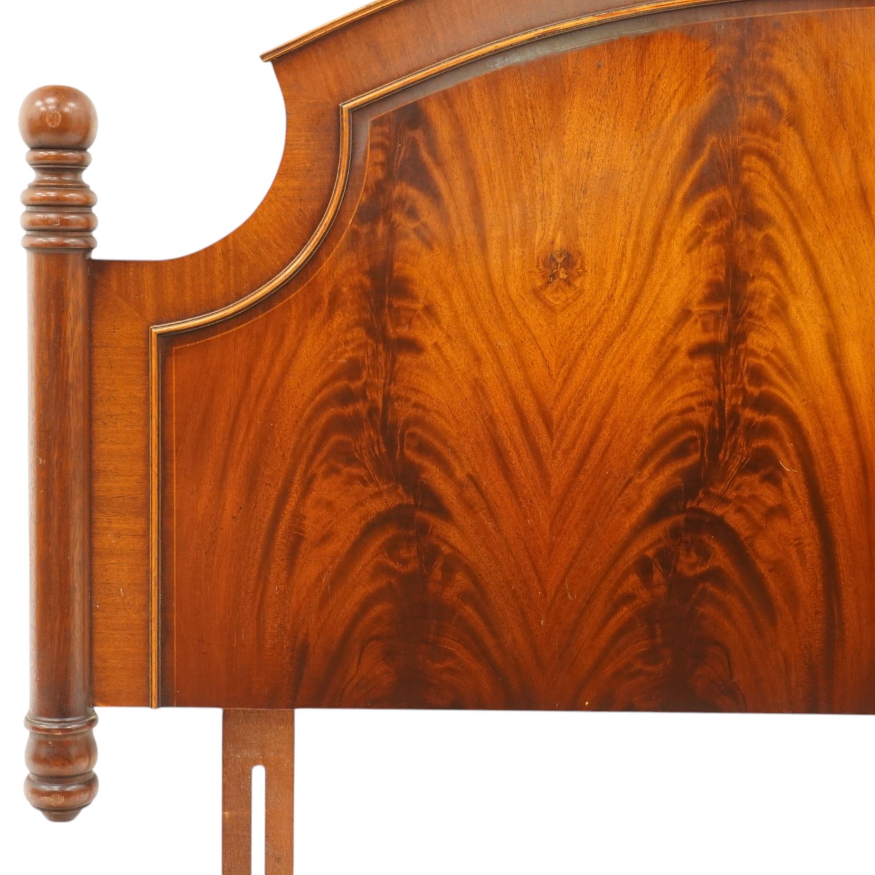 Two 20th century headboards, one with scrolled rail above a pink button backed board (H c127m, W 137cm) the second with flamed mahogany veneer (H 117cm, W 163cm)