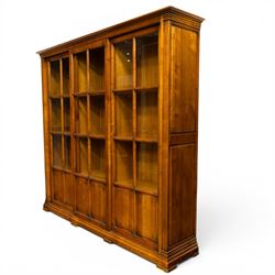 Wesley Barrel - large cherry wood bookcase, with projecting cornice and fielded panelled s...