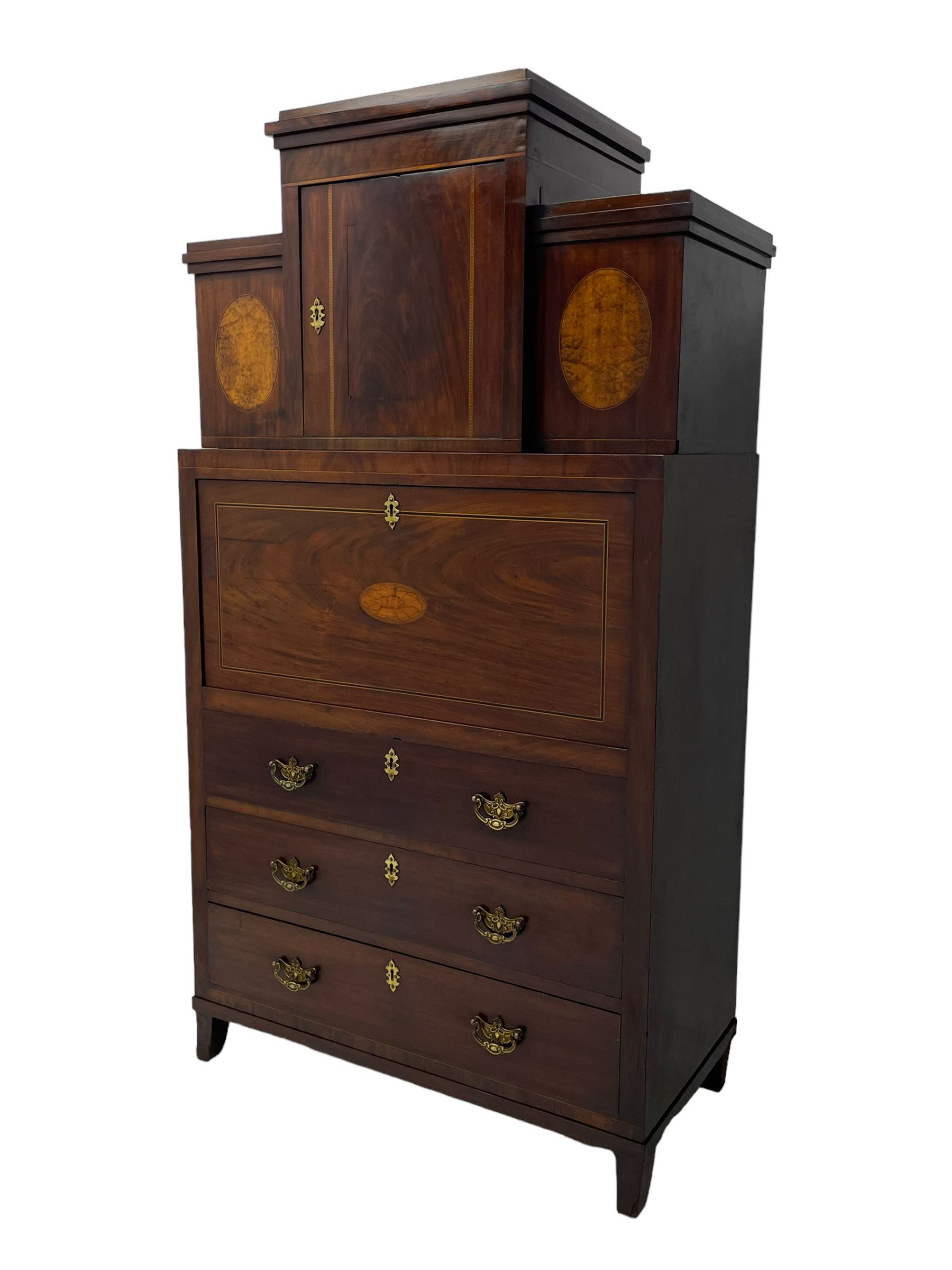 Early to mid-19th century figured mahogany Continental secrétaire à abattant, stepped top fitted with single cupboard, inlaid with oval figured amboyna panels, the fall front inlaid with shell motif enclosing a satinwood interior fitted with cupboard, drawers, and pigeon holes, three long drawers below, on square tapering feet