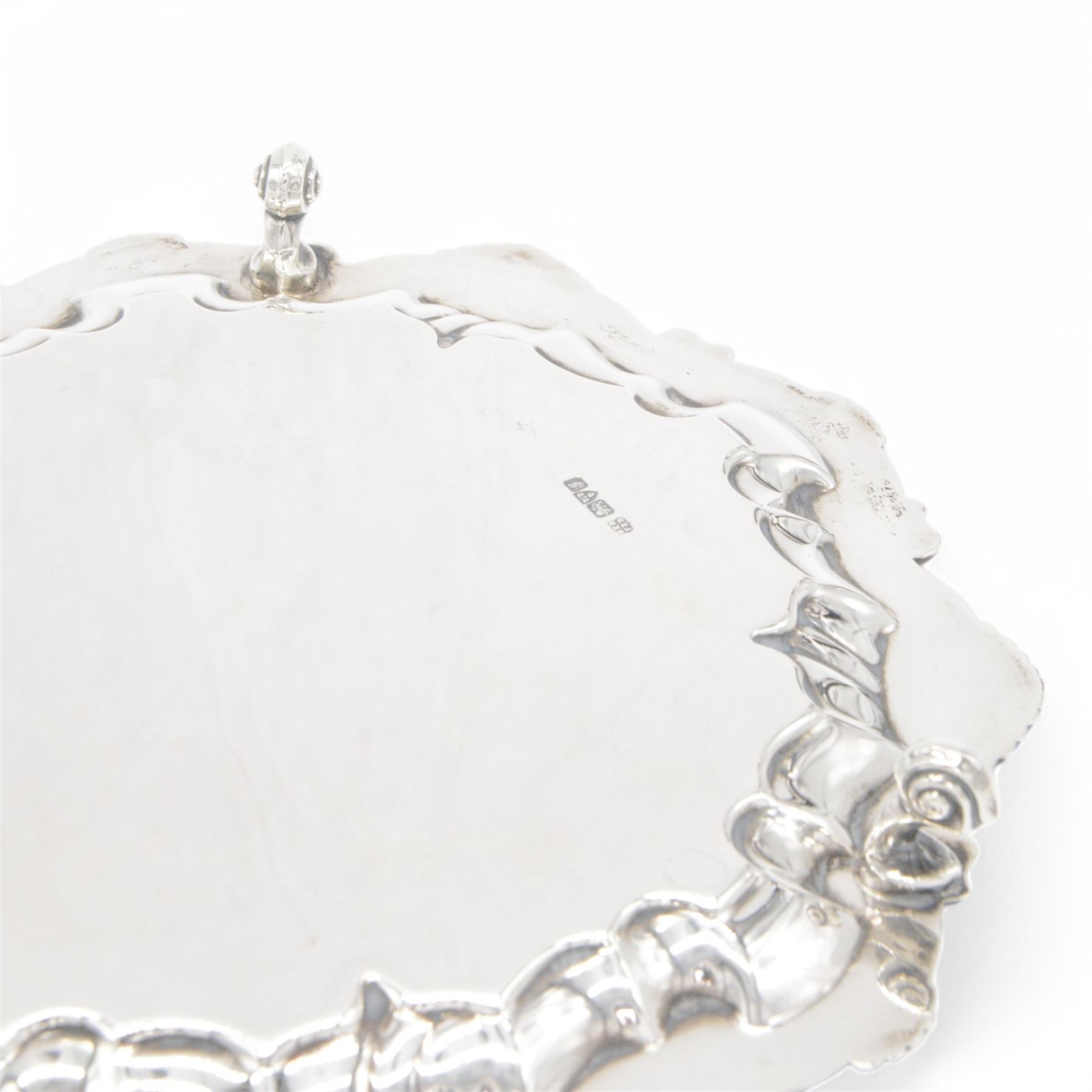 Edwardian silver waiter, of typical form with palmette and C scroll rim, upon three scroll feet, hallmarked Chester 1909, maker's mark MEB over FEB, W23cm