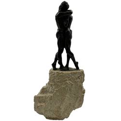 Composite sculpture embracing couple, after Joseph Bofill on a rocky base, height 33cm.