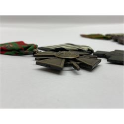 Four French medals - St. Helena medal with bust of Napoleon to obverse and inscription to reverse 'Campagnes de 1792 a 1815. A ses compagnons de gloire sa derniere pensée Ste. Hélène 5 Mai 1821', established by Emperor Napoleon III in 1857; two WW2 Croix-de-Guerre; and WW2 Croix-du-Combattant; all with ribbons (4)