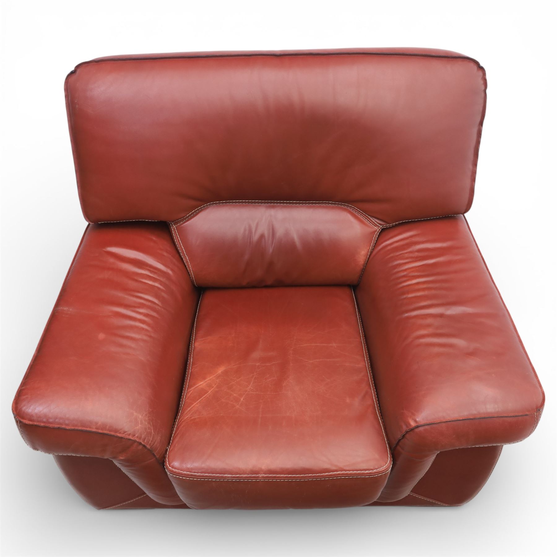 Fabrizio Mantellassi - 20th century Italian red leather suite, one three seat and two large armchairs, upholstered in deep red hide with stitched seam detailing, with magazine pockets to each side, the rectangular back cushions above broad padded arms and seat cushions, raised on low block bases

Sofa: H c98m, W 203cm, D 92cm
Armchair: H 98cm, W 113cm, D 92cm