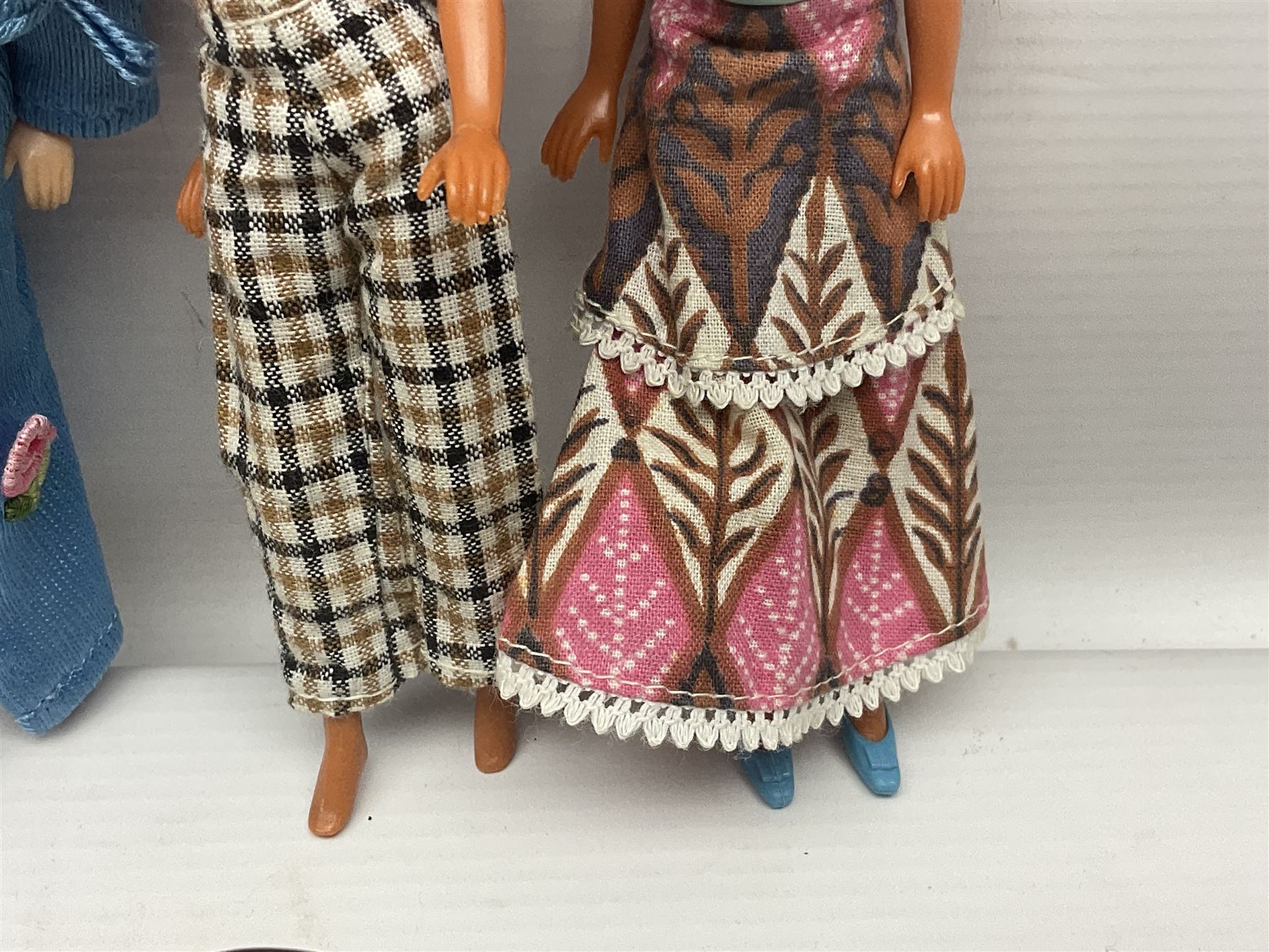 Seven Pippa dolls and a collection of plastic dolls house furniture