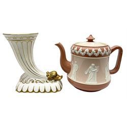 Late 19th century Wiltshaw & Robinson, early Carlton Ware teapot, decorated in relief with Grecian figures on pink ground, registration number 289951, H16cm, together with a Coalport cornucopia vase, both with printed marks beneath