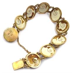  Chinese 18ct gold mounted operculum (evil eye) panel bracelet, stamped 18 with maker's mark WN and date mark, and four additional opercula  