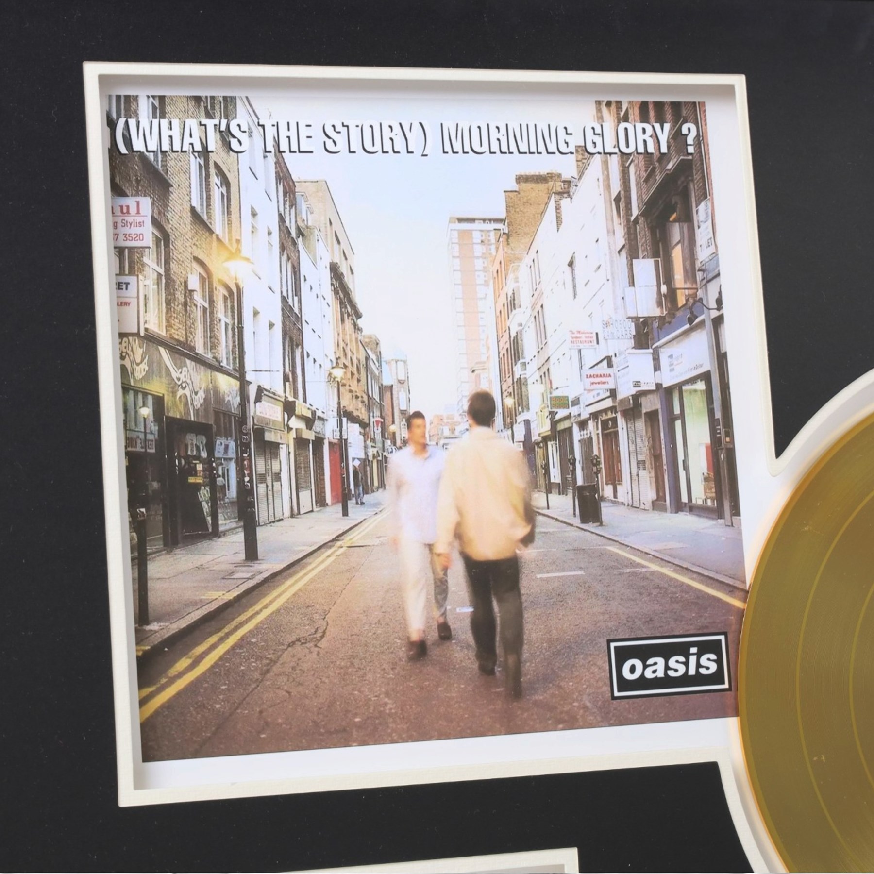Oasis What's The Story Morning Glory? commemorative gold disc display, featuring gold coloured record, album artwork and track listing, framed and glazed, H40cm, W60cm