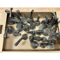 Collection of 44 late 19th century brass church/musical handbells with leather straps by James Shaw Brothers of Bradford and bells marked G.W. possibly cast by the George Welch bell foundry, London.
The number of bells and stated notation, some at different pitch, is as follows;
5 “C”, 4 “D”, 5 “E”, 4 “F”, 5 “G”, 5 “A”, 6 “B”.
3 “F#”, 4 “C#”,1 “Db”, 1 “G#”, 1”A#”.
Two of the bells are minus their clappers and one bell has no leather strap.
