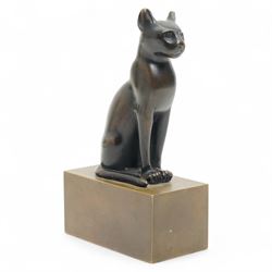 After the antique - Egyptian bronze of the goddess Bastet in the form of a seated cat on a...