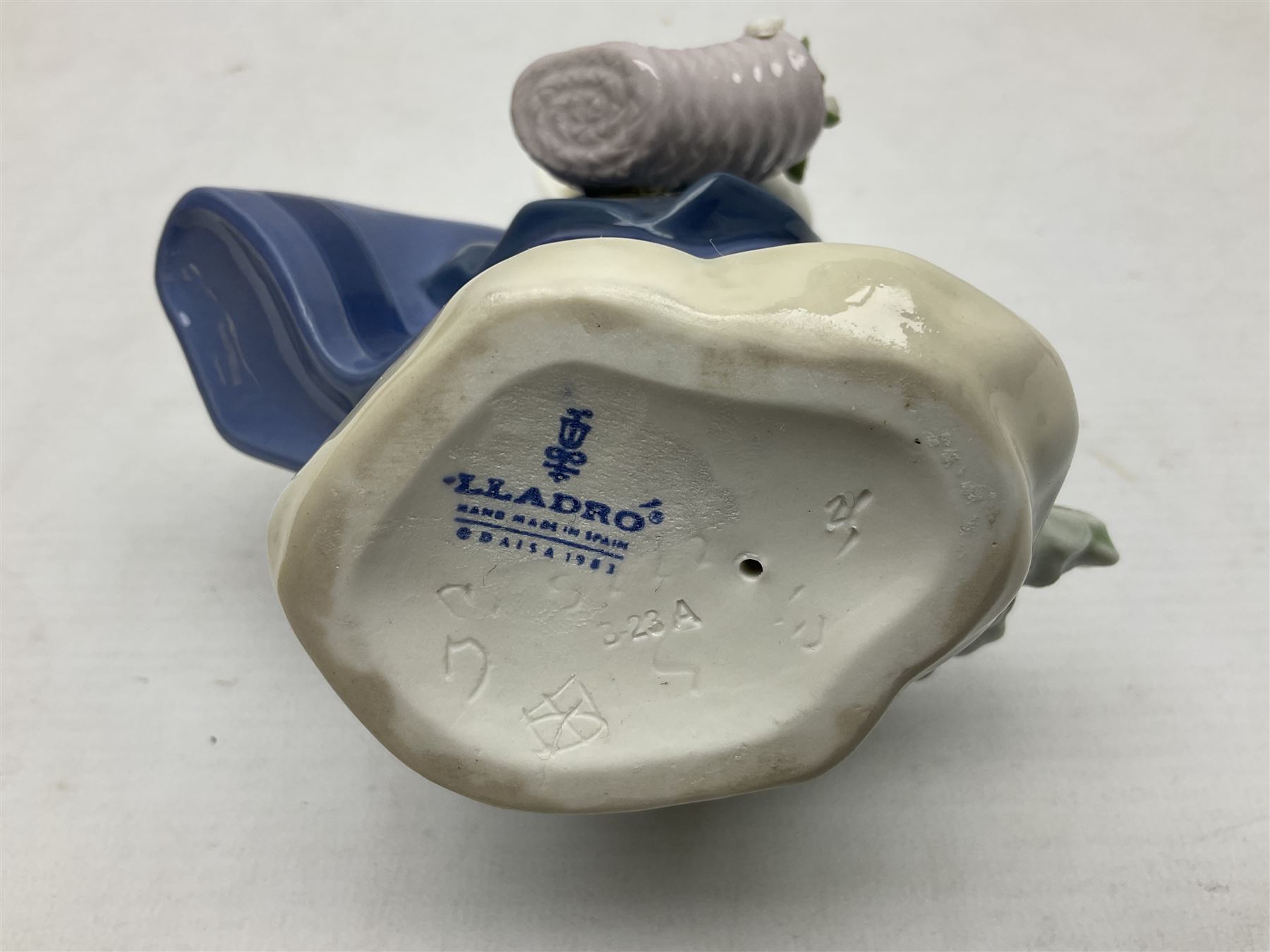 Three Lladro Flower Girls figures, comprising Sweet Scent no 5221, Pretty Pickings no 5222 and Spring is Here no 5223, largest example H18cm 