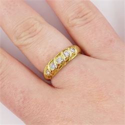 18ct diamond five stone ring, five round brilliant cut diamonds set within a twisted setting, stamped K18 Pt900, total diamond weight approx 0.35 carat