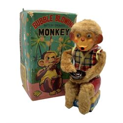 Battery operated bubble blowing monkey, 