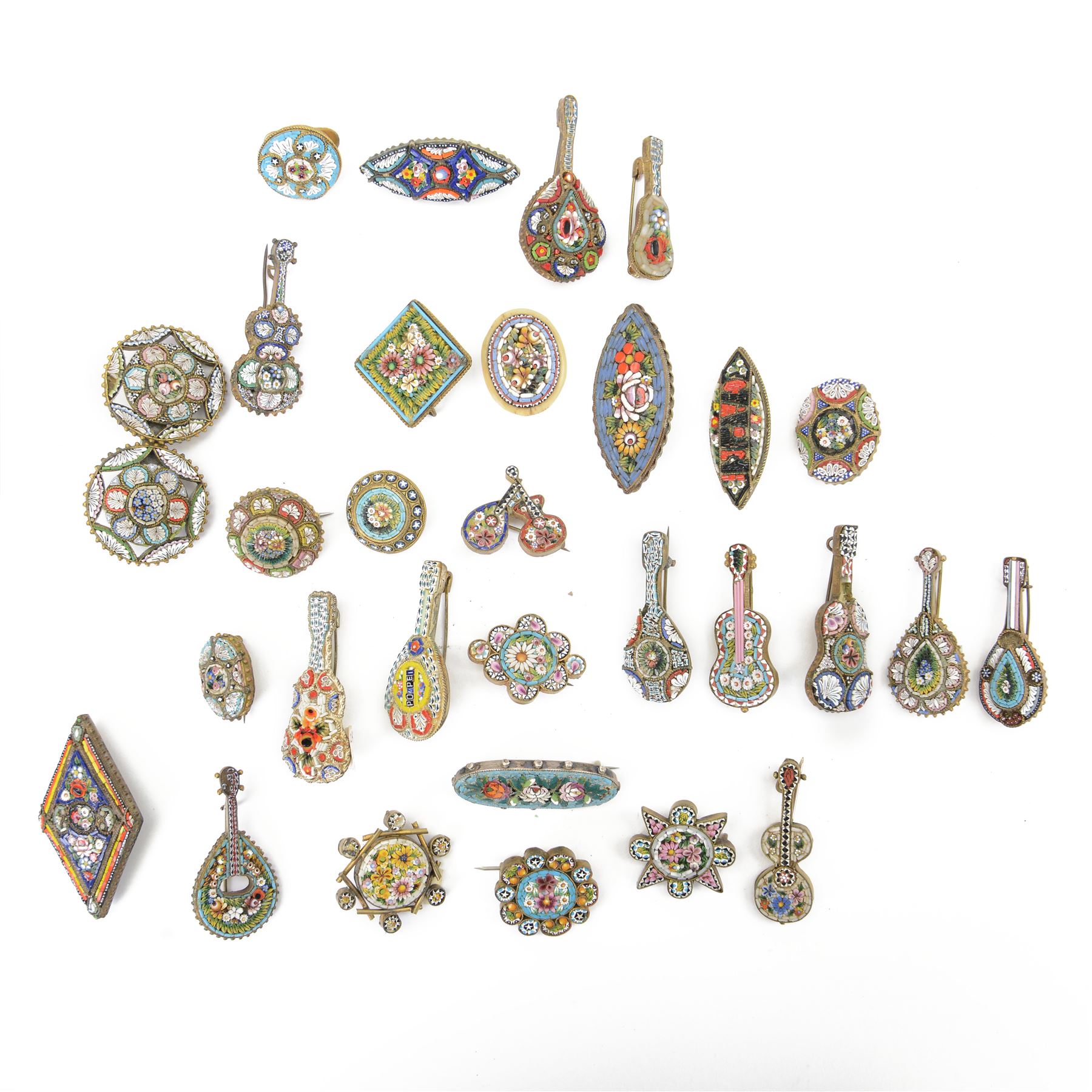 Twenty eight micro mosaic brooches including a Pompei examples, in various shapes including musical instruments 