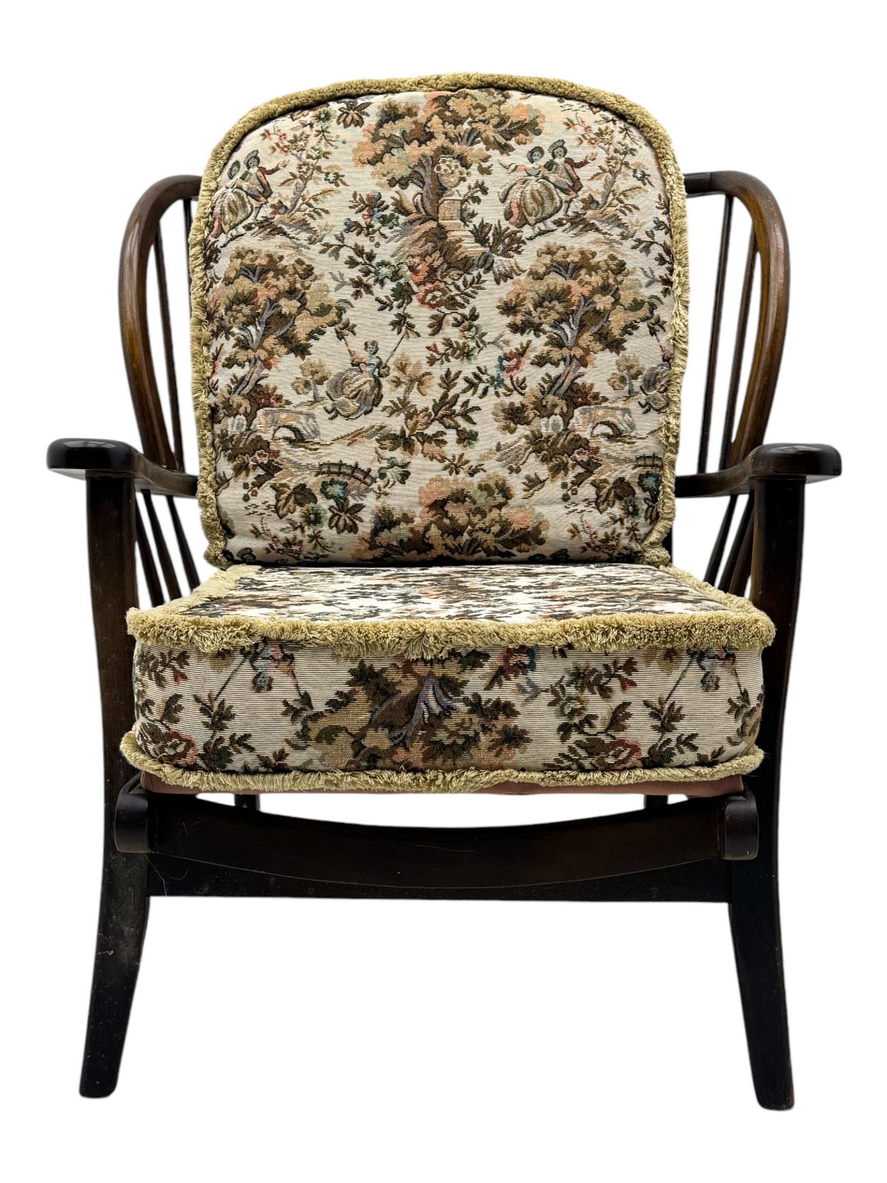 Joynson Holland - pair of mid-20th century stained beech framed easy chairs, shaped back and flat armrests over floral tapestry cushioned seat and back, on splayed supports united by stretcher
