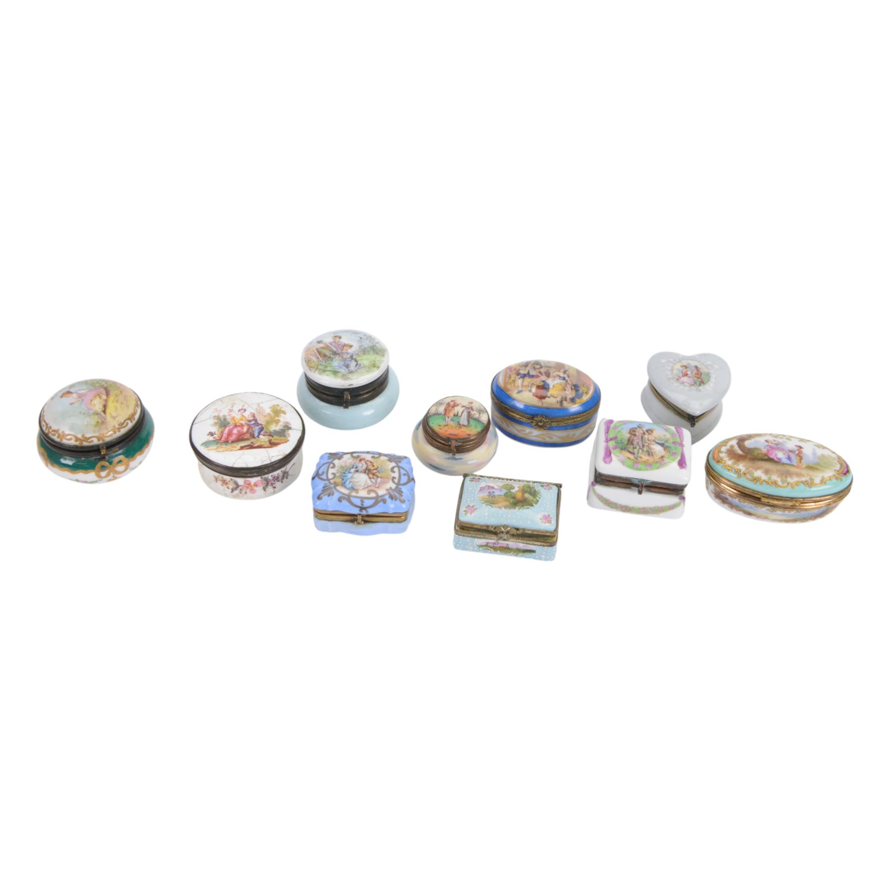 Ten porcelain boxes, of various form, each with printed decoration of figures