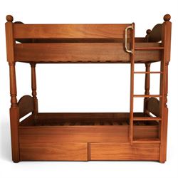 Modern cherrywood single bunk beds, with ball finials, curved headboard and footboard, lad...