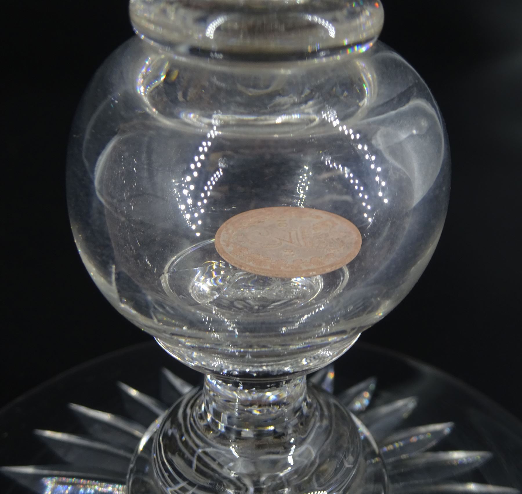 Late 19th century oversized glass goblet, the bowl engraved with cartouche containing dedication 'Jams Michie Died Jan 6th 1871 Aged 26 Years', surrounded by foliate detail, upon a hollow knopped stem containing a silver Victorian 1861 threepence and circular foot with star cut base, H19.5cm