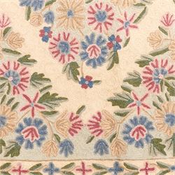 Kashmiri chain stitch crewel embroidered wall hanging, wool on cotton ground, decorated with an all-over lattice of floral medallions and stylized foliage with multiple floral borders