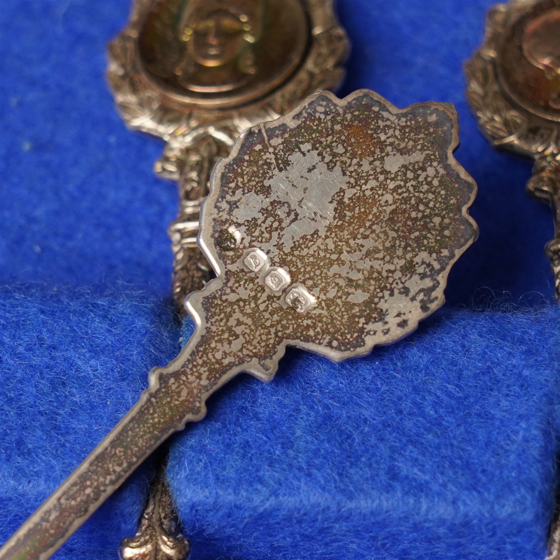'The Twelve Roman Spoons' a set of twelve silver spoons each with the head of a Deity in fitted case London 1971 Maker John Pinches