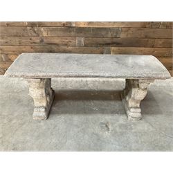 Cast stone garden Rams Head bench, two pillars set with architectural rams heads, rectangular slab seat