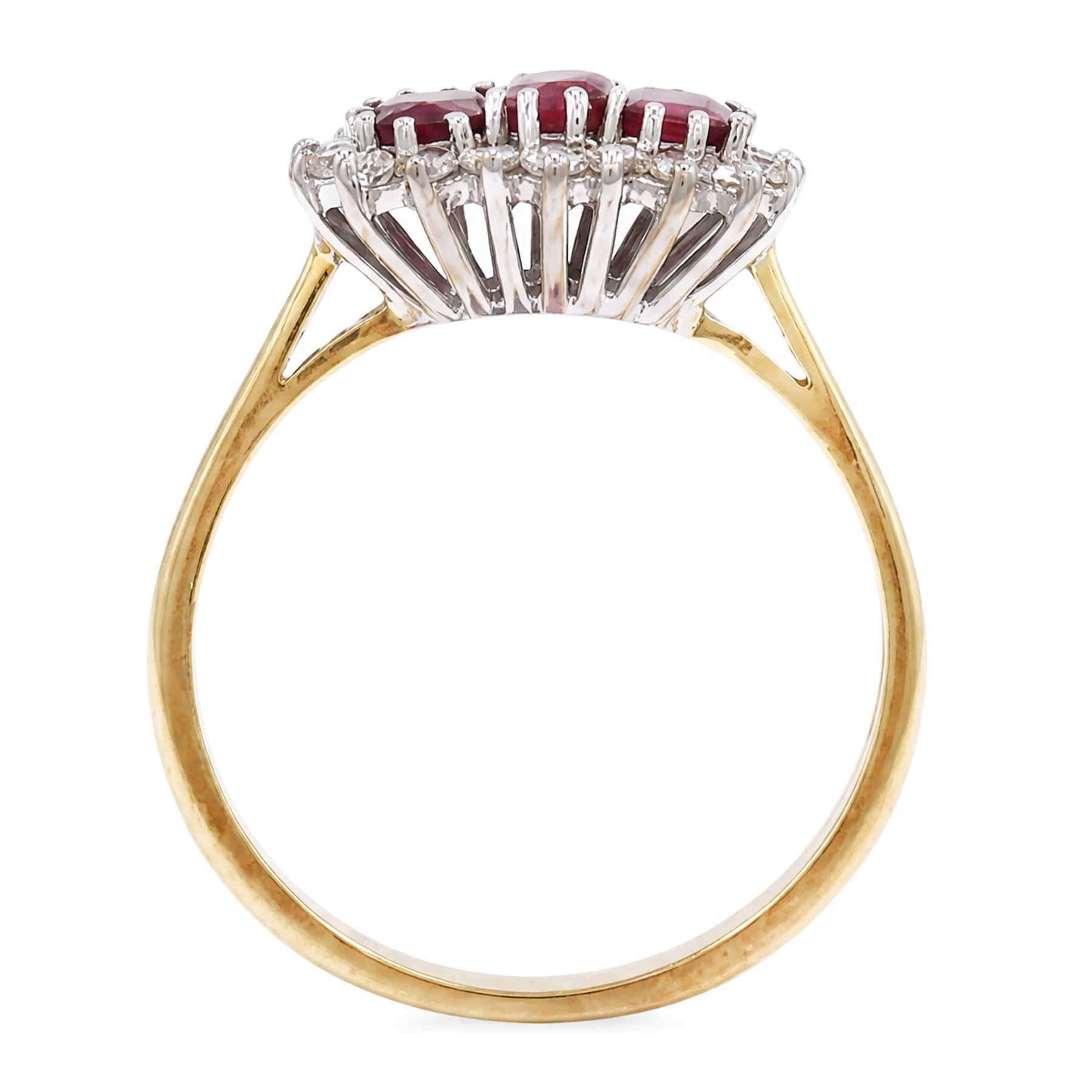 18ct gold ruby and diamond cluster ring, three oval cut rubies surrounded by eighteen single cut diamonds, London 1979, total ruby weight approx 0.55 carat, total diamond weight approx 0.20 carat