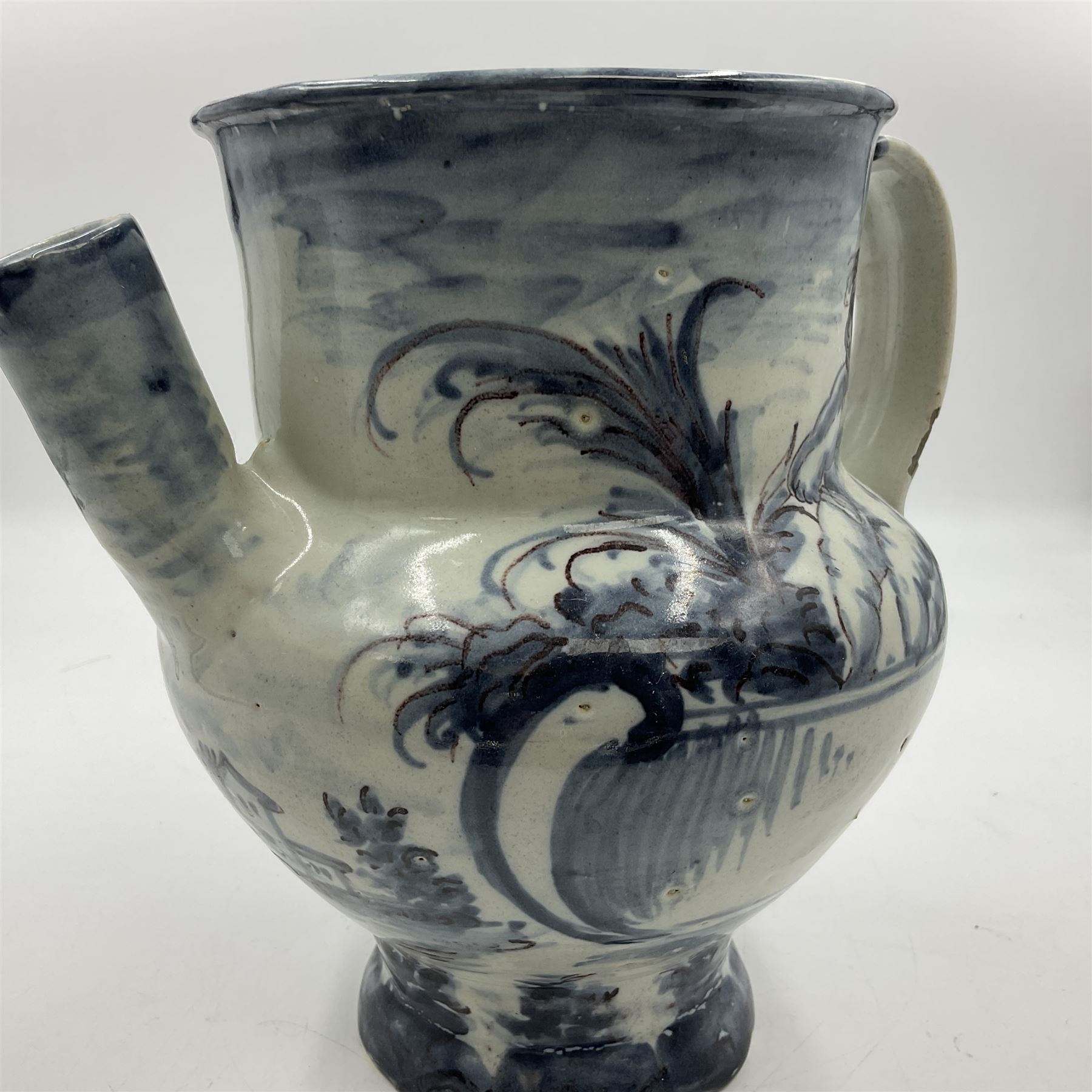 Tin glazed earthenware wet drug jug, decorated with cherubs in a landscape, H90cm 