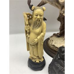 Composite figure of a couple upon a rearing horse, together with a collection of resin immortals and two bone chests 