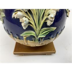 Minton majolica vase, the squat body with twin handles, with part osier moulding and applied Spring flowers against a cobalt blue ground, upon integral square base, impressed beneath Minton 1316, H16.5cm