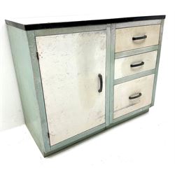 Painted metal preparation cabinet, Single cupboard next to three graduating drawers 