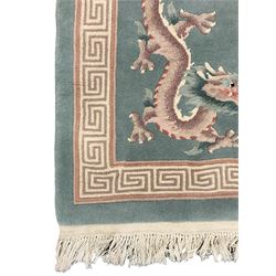 Chinese jade ground woollen rug decorated with dragons 