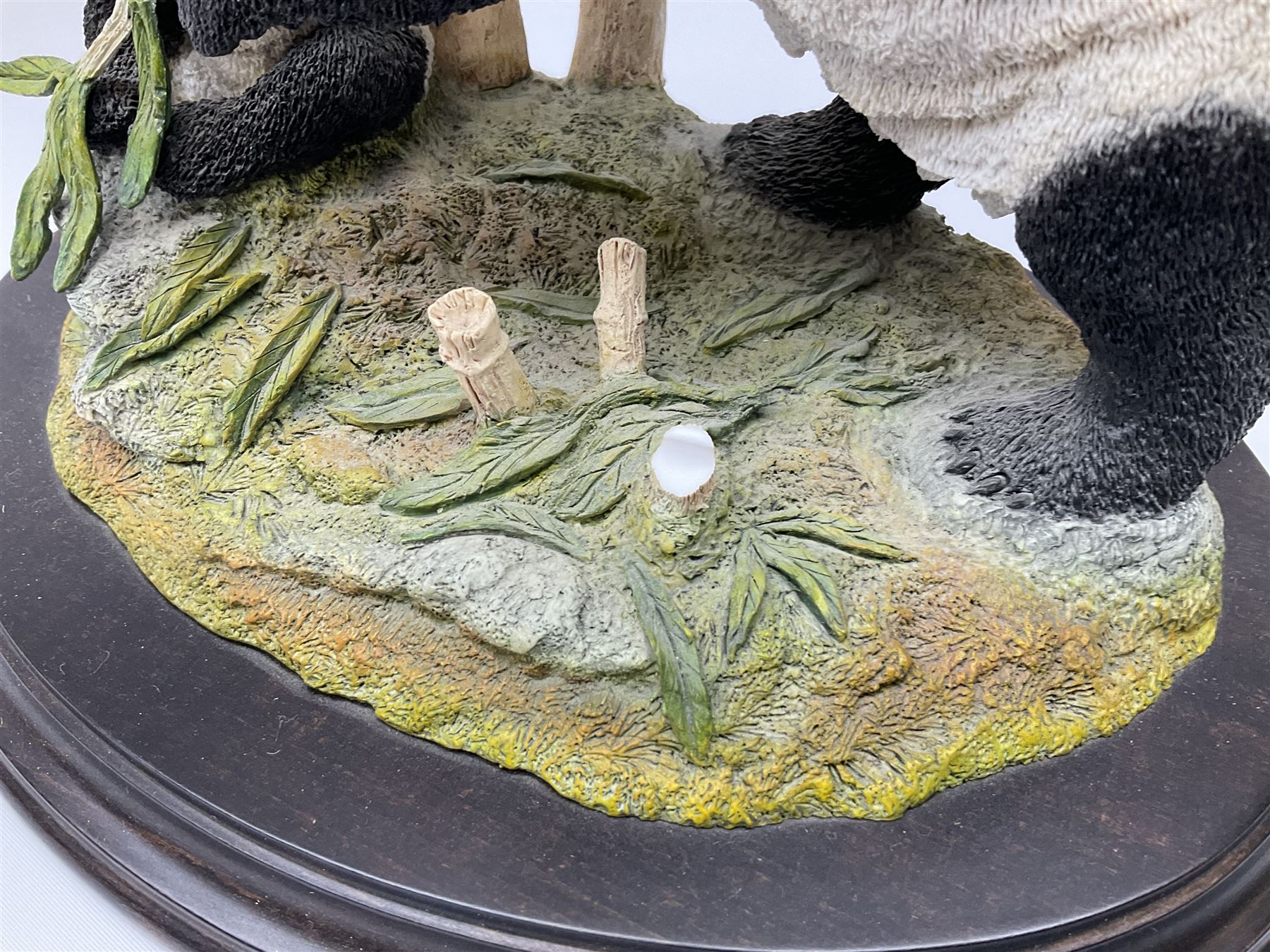 Three Franklin Mint figures, first example On The Prowl, on wooden stand H32cm, L63.5cm, Grizzly, H23cm and American Majesty by Ronald Van Ruyckevelt H37cm, together with five other figures.  