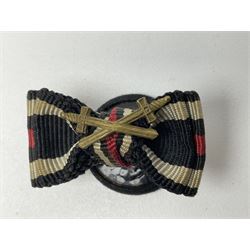 Four German awards - pre-WW2 two-position button hole ribbon for 1914 Iron Cross; WW1 wound badge open back cut-out version with silvered finish; miniature version Mother's Cross with ribbon bow; and The Eastern Medal, officially the Winter Battle in the East 1941–42 Medal (4)