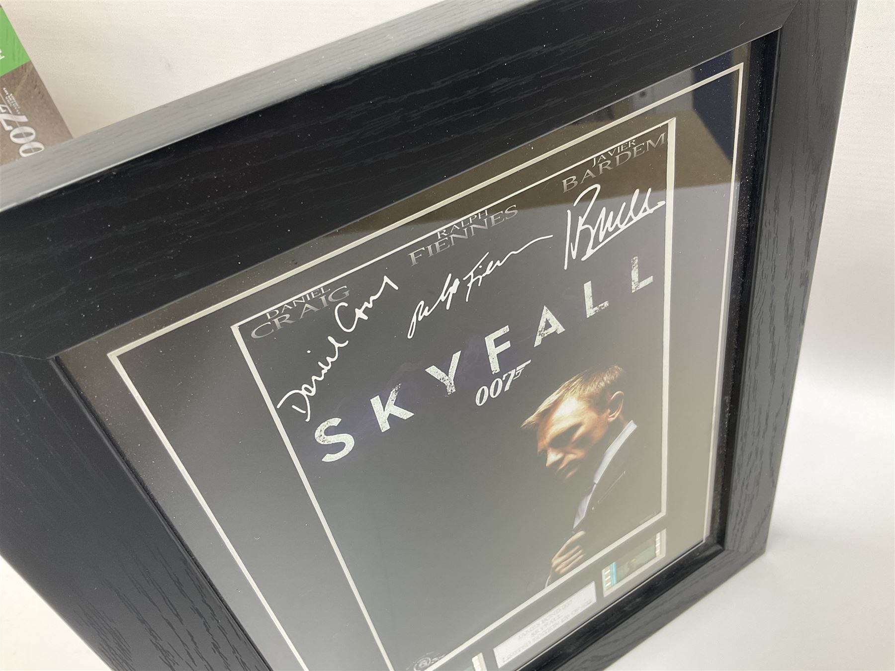 Limited edition framed James Bond 007 Skyfall print, 126/600, boxed Spectre pen, Aston Martin DB5 keyring and sealed 007 50th Anniversary Edition boxed monopoly game (4)