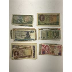 Great British and World banknotes, including five Bank of England Somerset one pound notes 'DX24', 'DT15', 'BY46', 'DN64' and 'CN26', Reserve Bank of Rhodesia two dollars '4th March 1975' and one dollar '2nd August 1979', Reserve Bank of Zimbabwe twenty dollars '1983 DA9901054J', South Africa ten pounds 'Pretoria 18.12.52 D1 925572', five pounds 'Pretoria 7.3.57 C56 386470', other South African banknotes etc