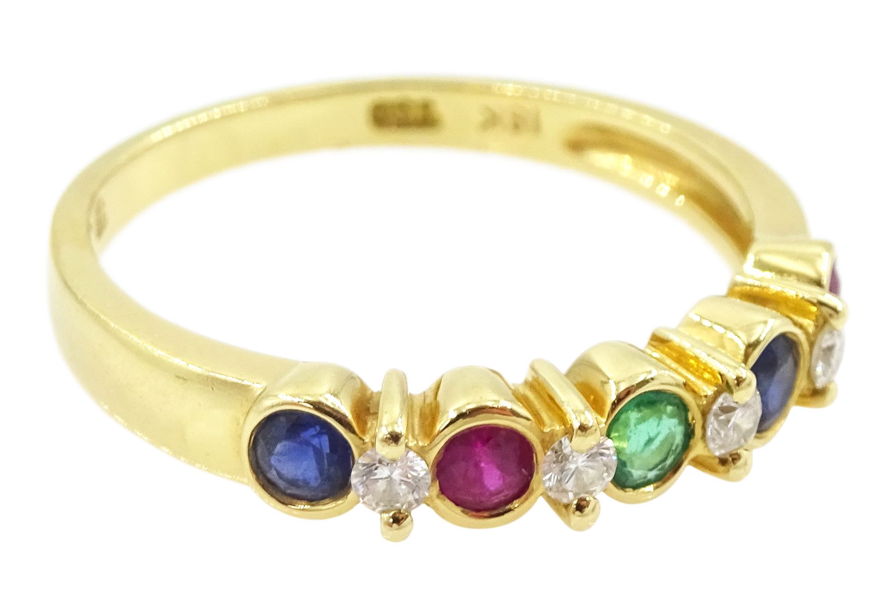 18ct gold nine stone, ruby, emerald, sapphire and diamond ring, stamped 750