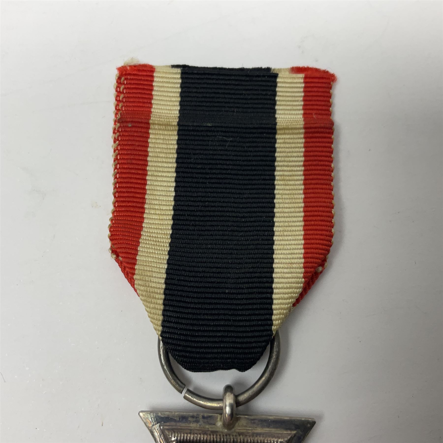 WWI Imperial German Iron Cross 2nd Class, the suspension ring indistinctly stamped M8?; with WWII ribbon