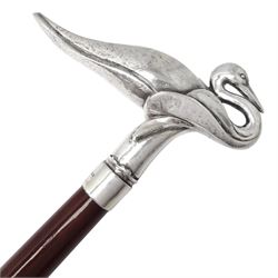 Art Deco style Italian 'Rivestito' covered silver walking stick handle, modelled in the form of a swan, stamped 'R', upon a silver collar hallmarked Birmingham 1986, makers mark DH-L, and hardwood shaft, L96cm

Provenance by vendor repute: 
This walking cane comes from a private collection amassed by the current vendors mother who was an Antique dealer specialising in walking sticks, working at the Portobello Road Antique Market in London for over forty years. 
In 1988 the prop crew from LWT (now ITV) visited Portobello Road looking for, amongst other items, a signature stick for David Suchet to use in his portrayal of Agatha Christie's Poirot. 
At the time this particular walking stick was one of five in possession. The prop crew chose and purchased another of the five which was then used by Suchet throughout all seventy episodes of the much loved series. 
Following the conclusion of the series Suchet was gifted his particular cane, which has been loaned to and can now be seen at the Agatha Christie Gallery at the Torquay Museum. 

