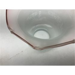 Victorian table oil lamp with black glazed stepped circular base, reeded brass column, moulded pink glass reservoir, duplex burner and frilled rim frosted glass shade with clear glass chimney H69cm