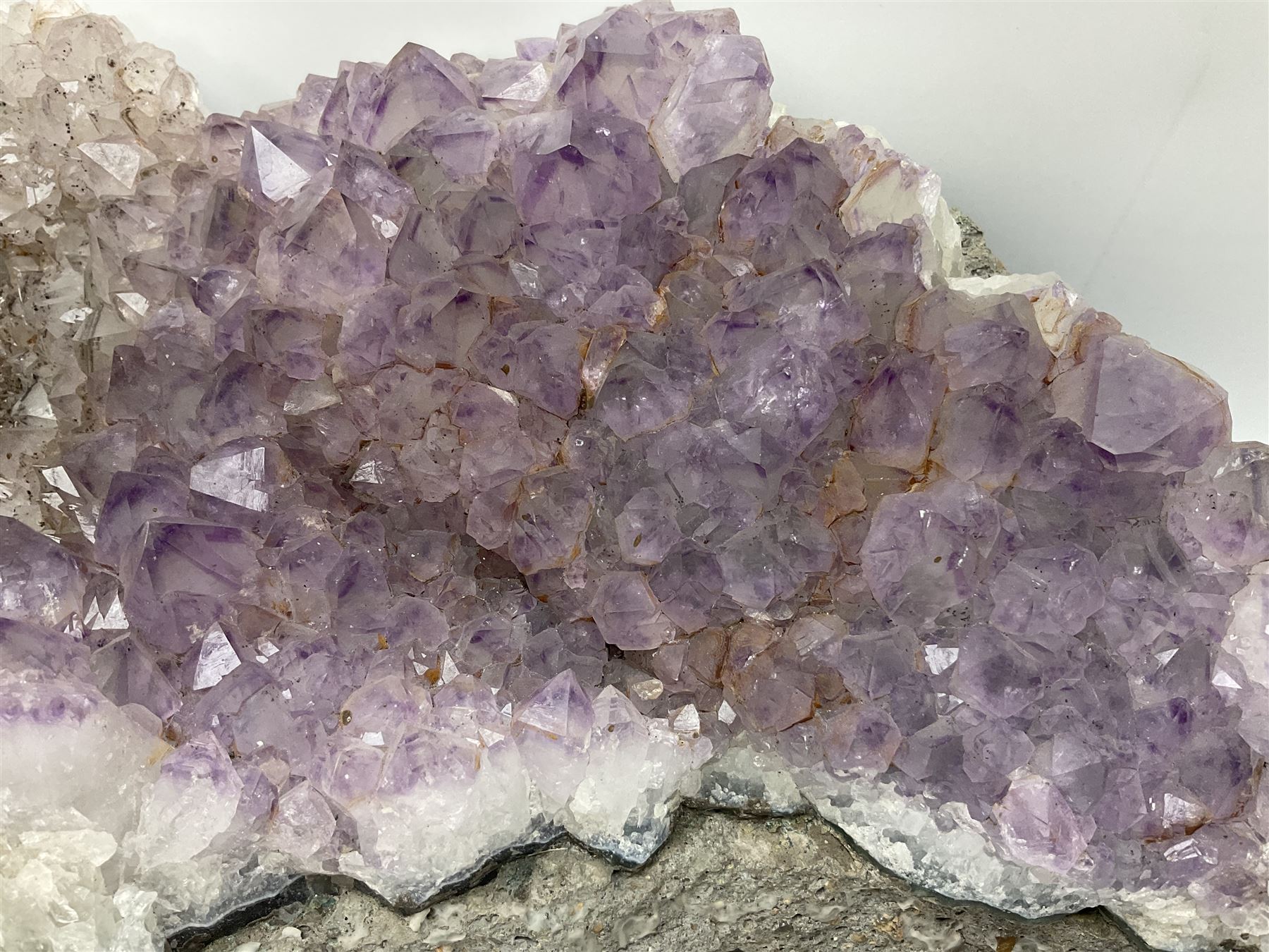 Amethyst crystal geode cluster, with well-defined crystals of various sizes, H13cm, L46cm
