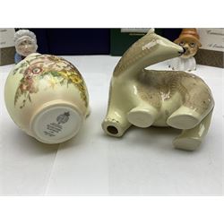 Two Royal Worcester candle snuffers from the connoisseur collection, comprising of Baby and Toby, together with Minton Fawn on Ivory Polar Bear and one other, all with original boxes 